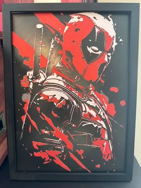 Framed red, black and white HueForge of a masked comic antihero