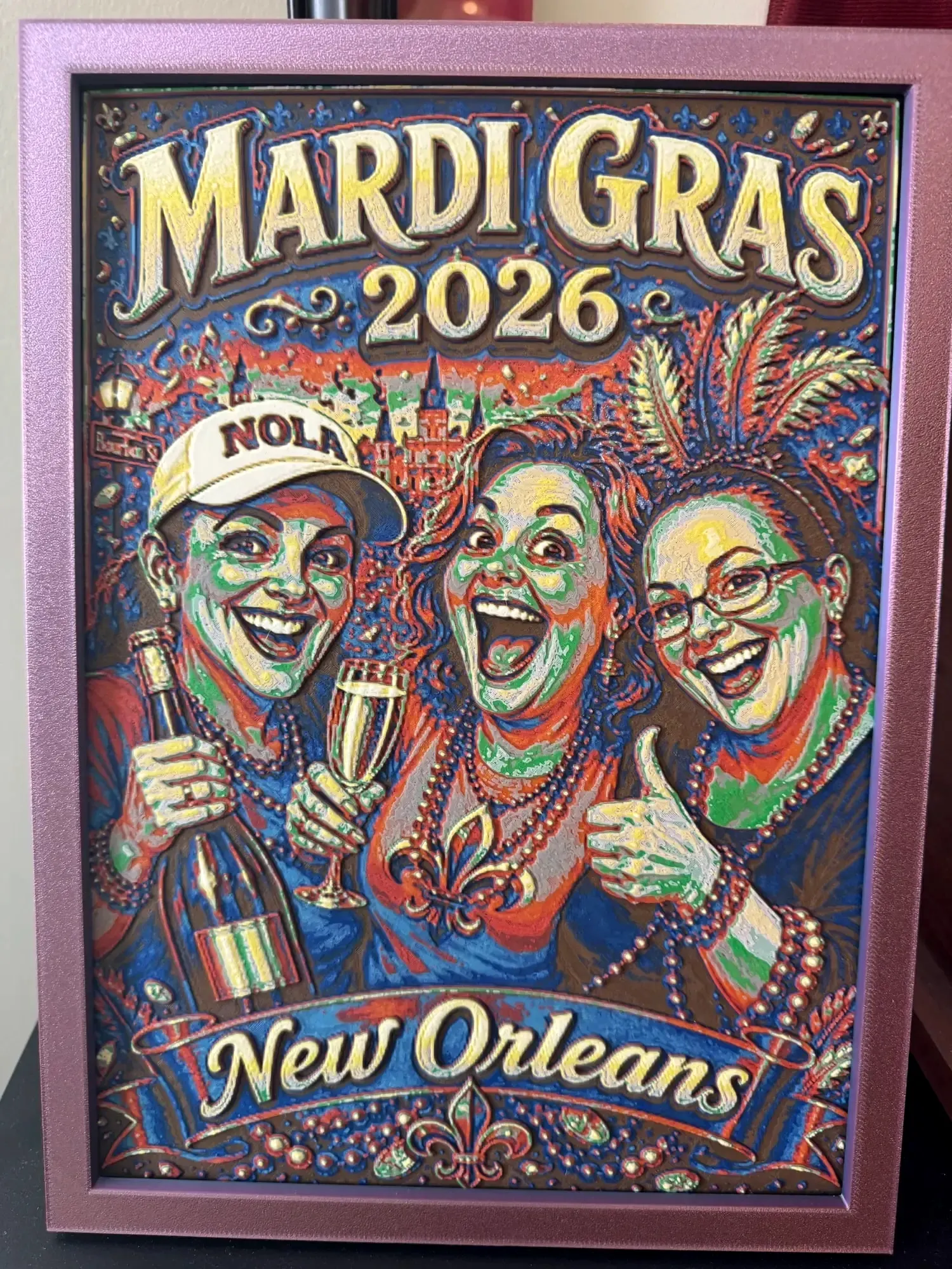 Framed multicolor HueForge of a Mardi Gras 2026 New Orleans poster with three friends celebrating, in a pink printed frame