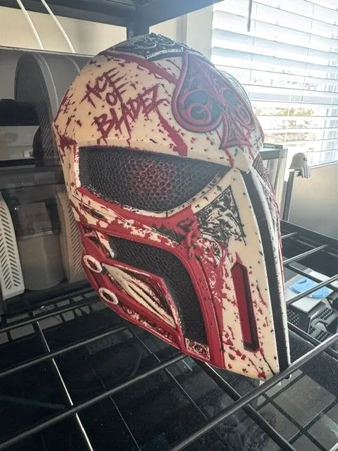 Ace of Bladez mask from the side, showing the lettering and layered detail