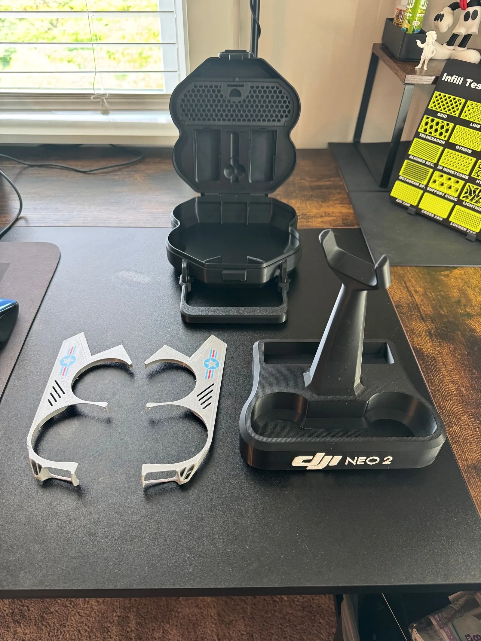 Printed carrying case, charging stand and propeller guards for a small drone